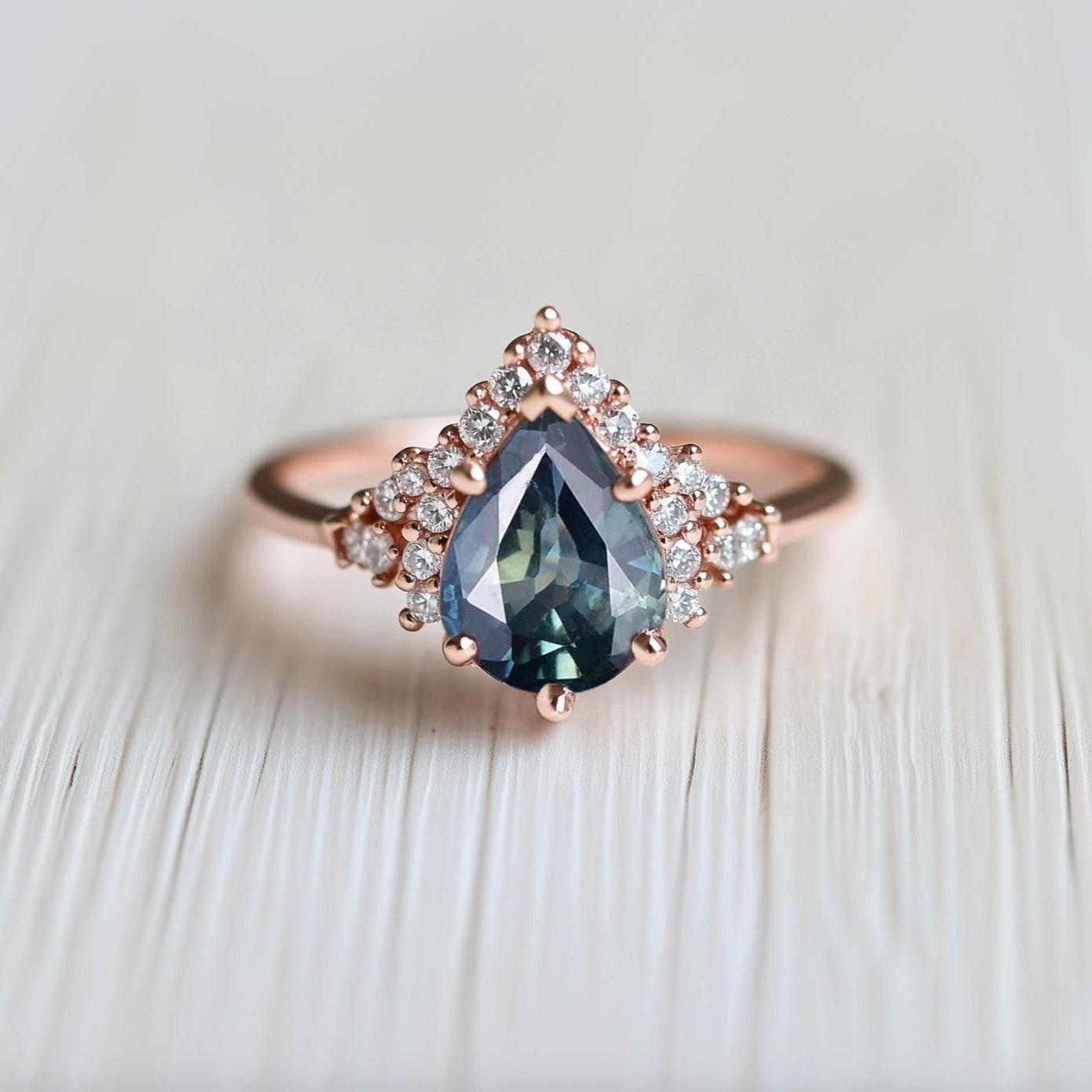Lyra’s Twilight | Pear Blue Sapphire Partial Halo Ring.