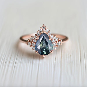 Lyra’s Twilight | Pear Blue Sapphire Partial Halo Ring.